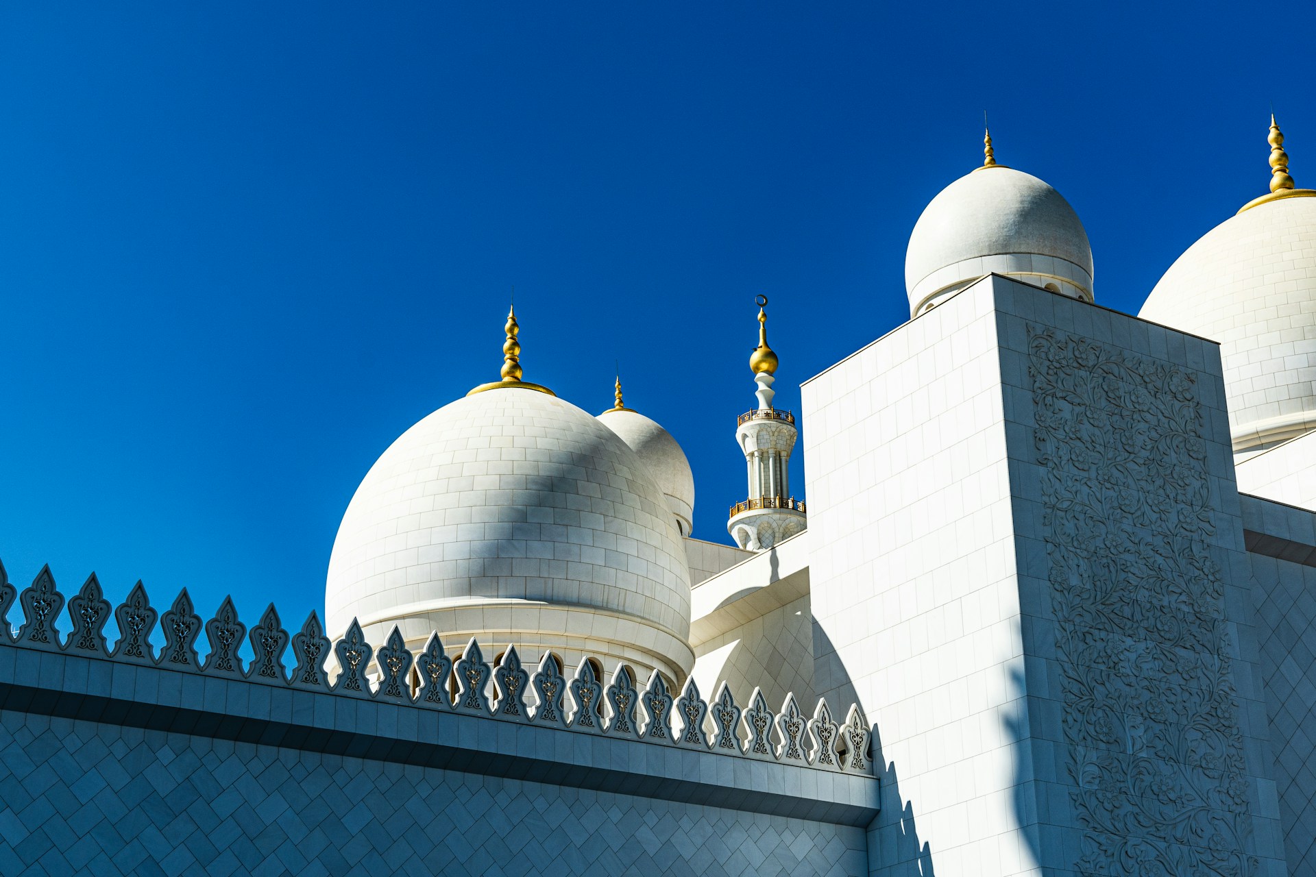 a large white building with two domes on top of it
