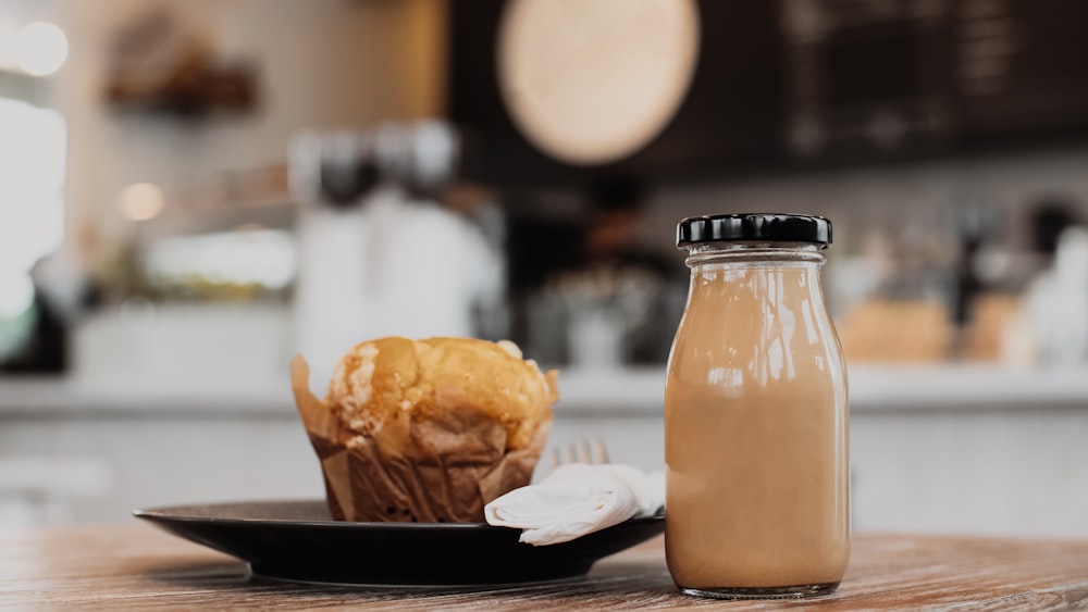 a bottle of milk next to a plate of food