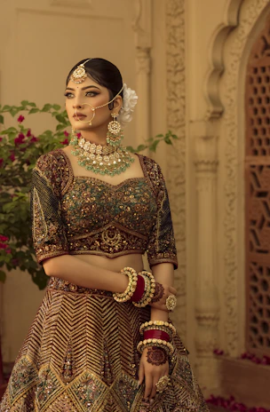 A woman in a bridal outfit standing in a room