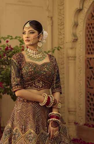 A woman in a bridal outfit standing in a room