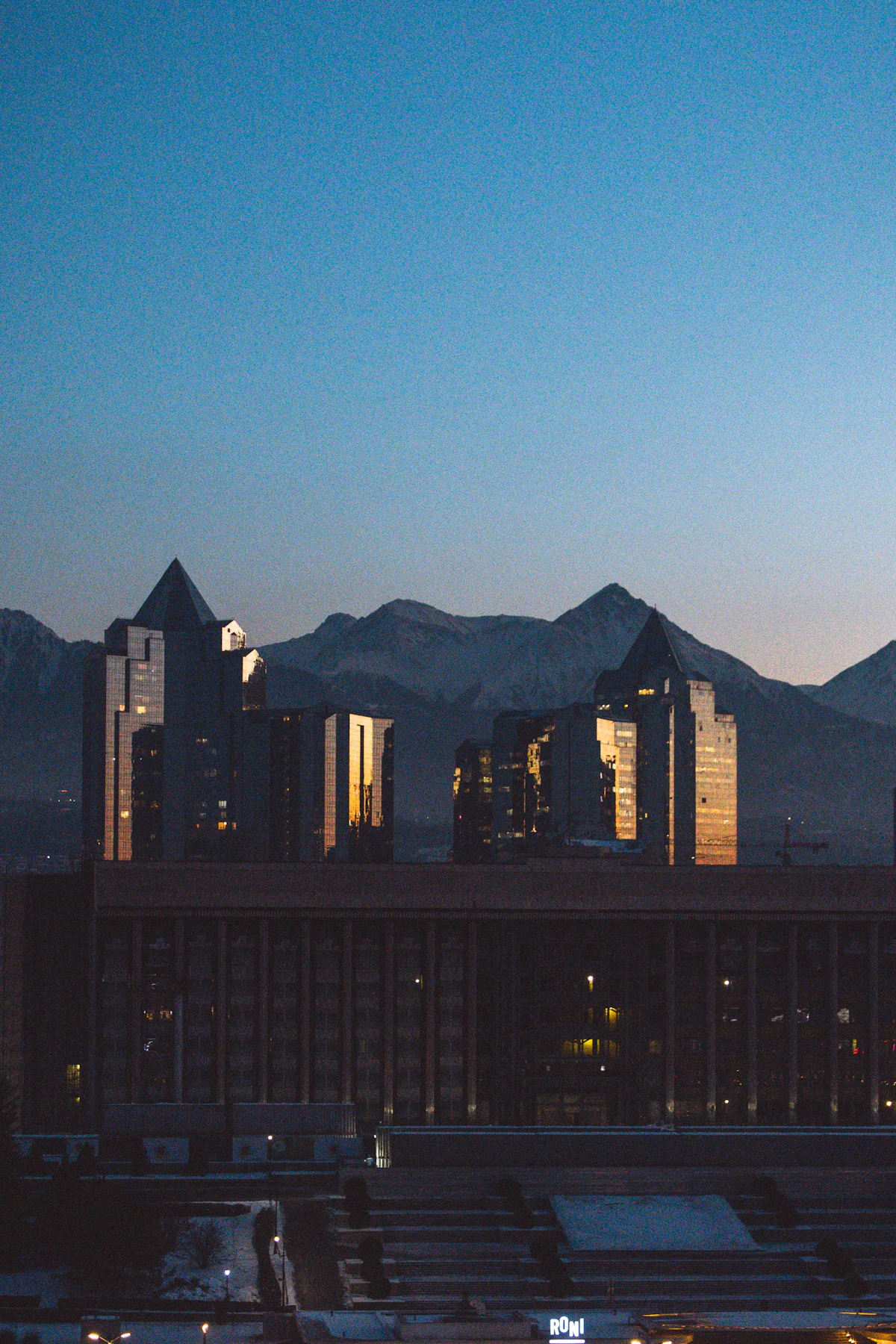 Almaty skyline at dusk with mountains in the background, Kazakhstan