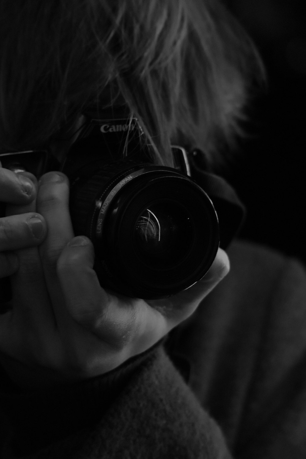 a person holding a camera up to their face
