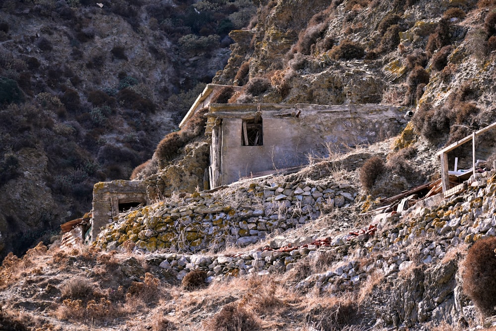 an old building on the side of a mountain