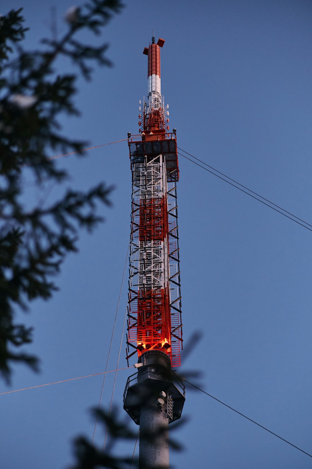 a tall tower with a red light on top of it