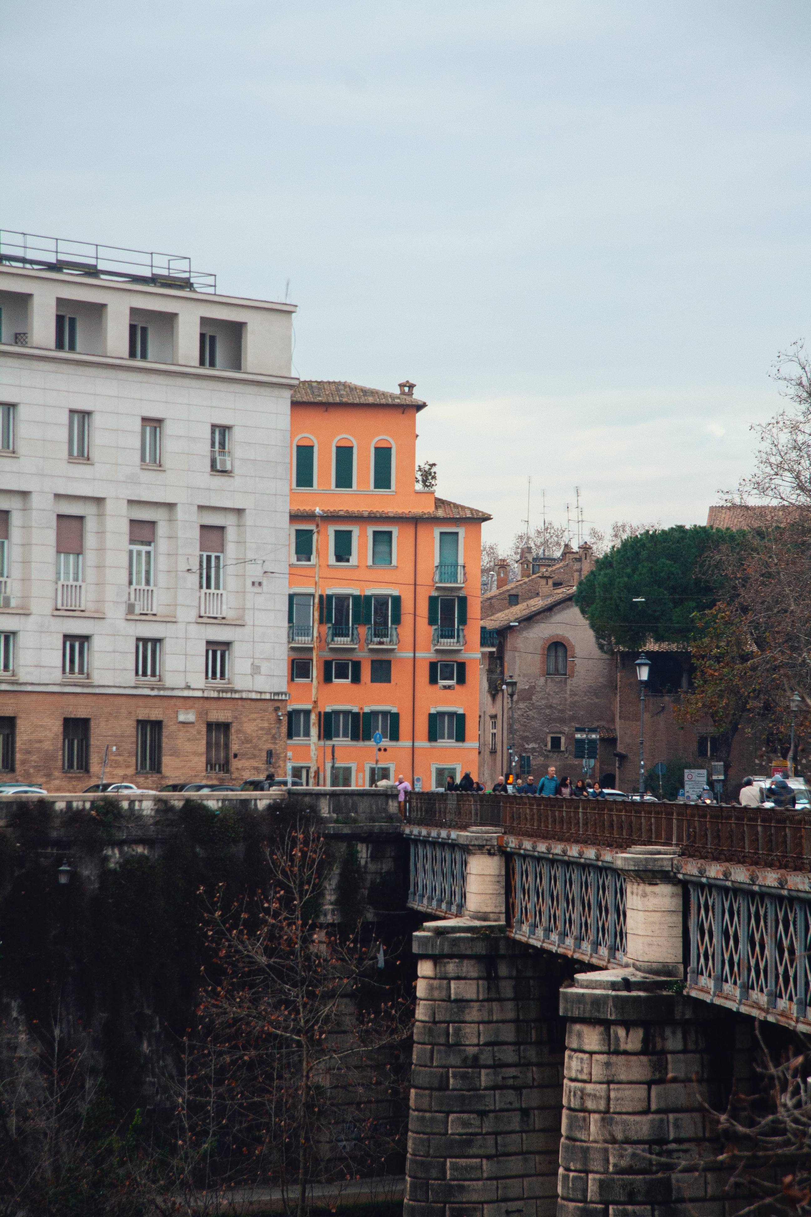 a bridge with a building in the background