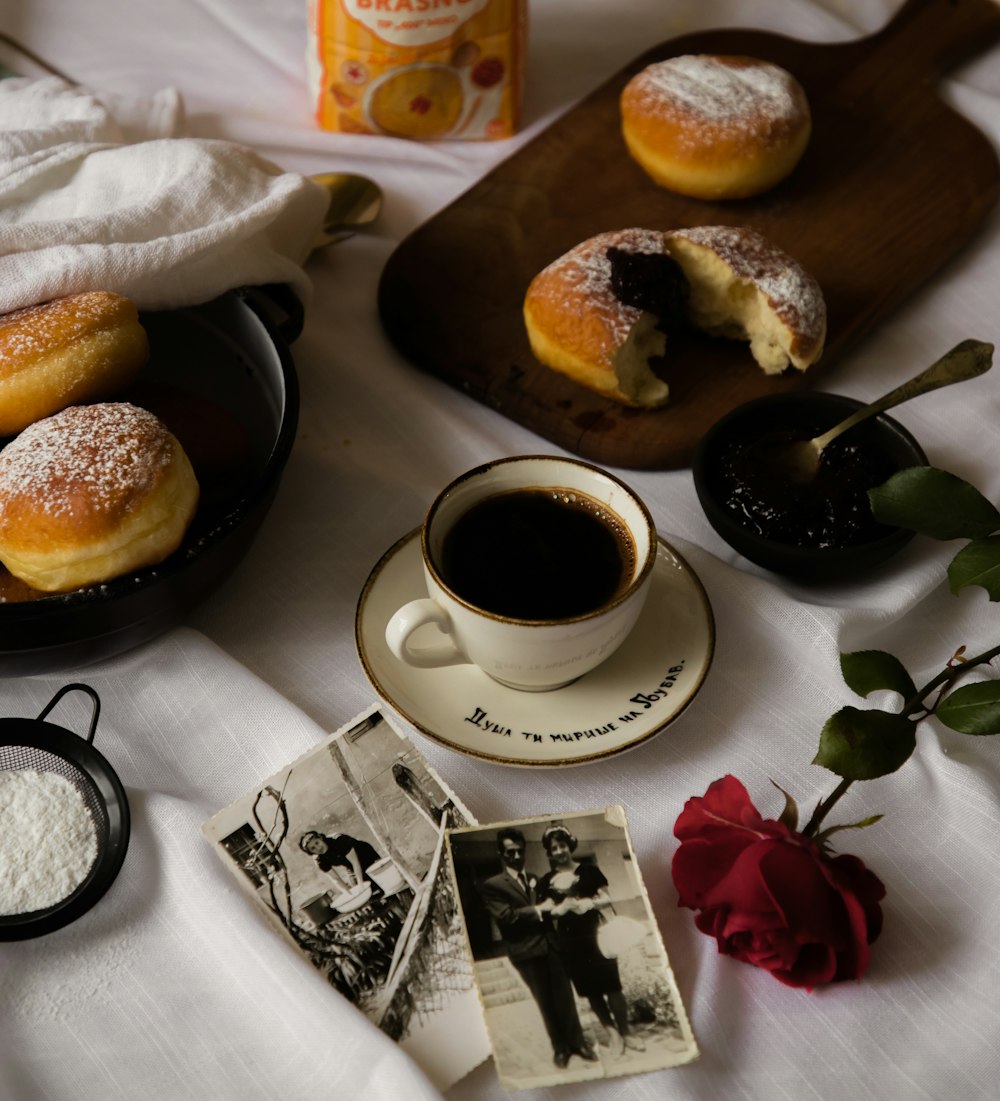 a table topped with pastries and a cup of coffee