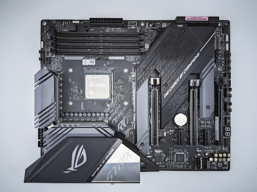 a close up of a computer motherboard on a white surface