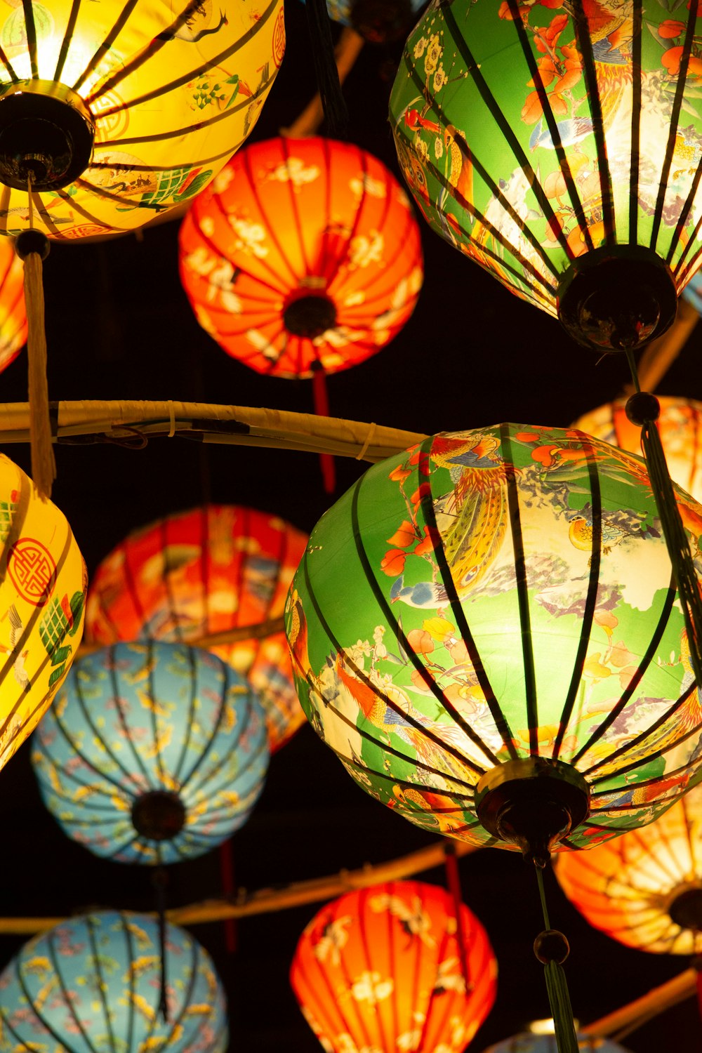 a bunch of colorful lights hanging from a ceiling