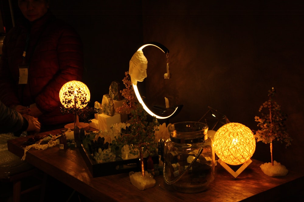 a wooden table topped with lots of lights