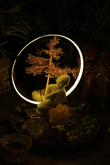A serene altar with candles, crystals, and a small statue of a meditating figure.