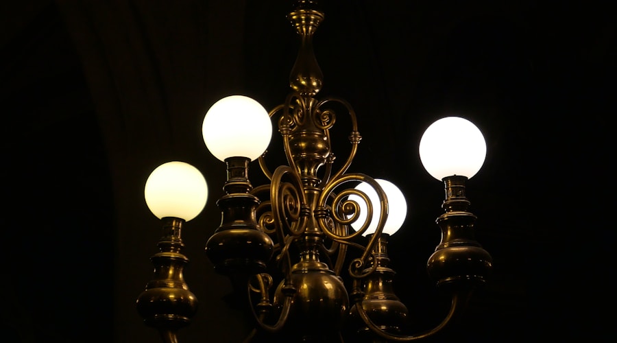 a chandelier hanging from a ceiling in a dark room