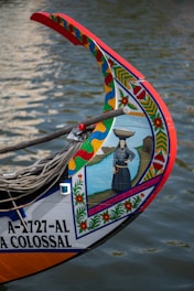 a close up of a boat with a painting on it