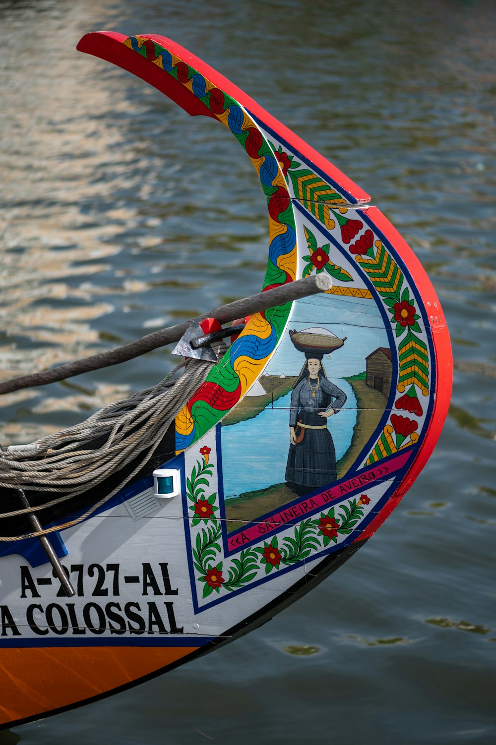 a close up of a boat with a painting on it