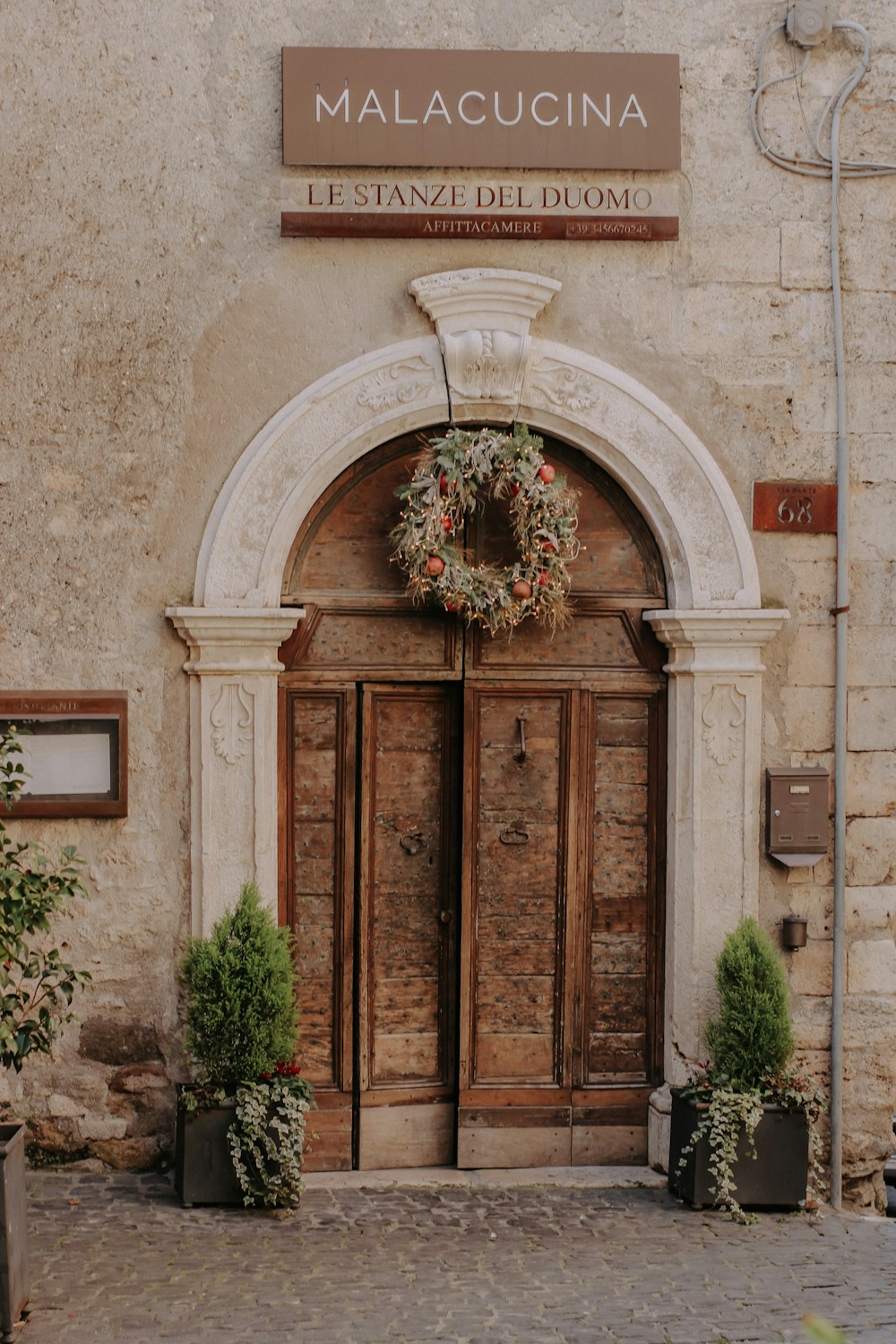 a couple of doors that are next to a building