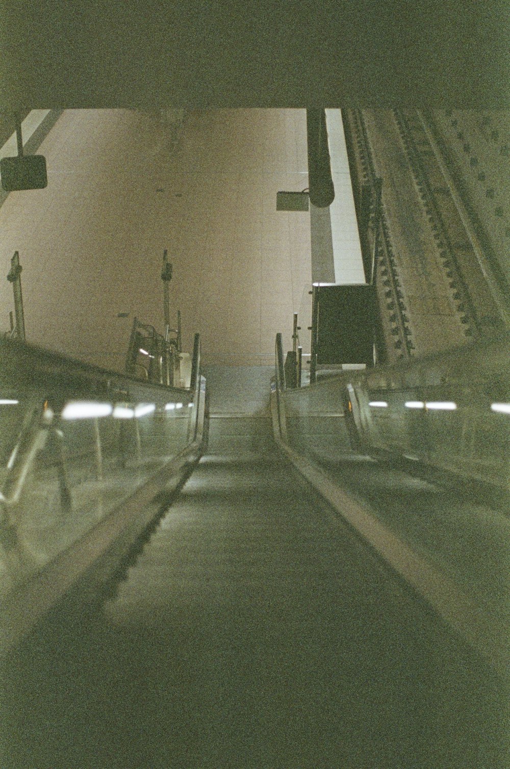 an escalator in a subway station with people on it