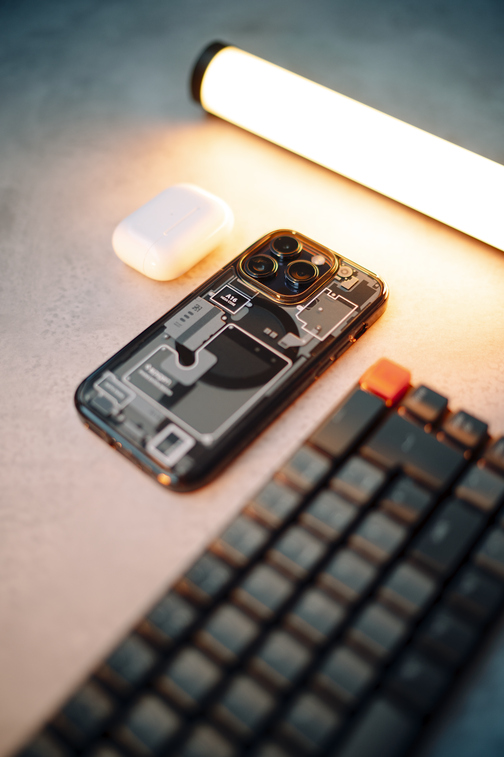 a cell phone sitting on top of a table next to a keyboard