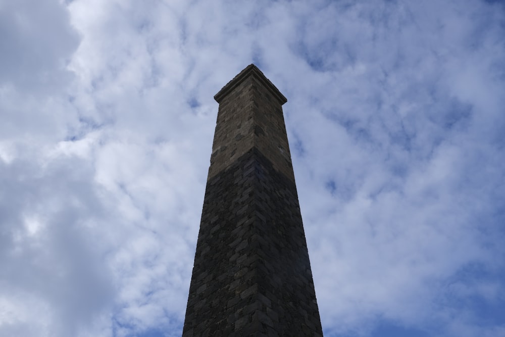 a tall brick tower with a sky background