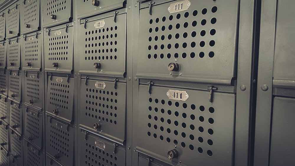 a row of metal lockers with numbers on them