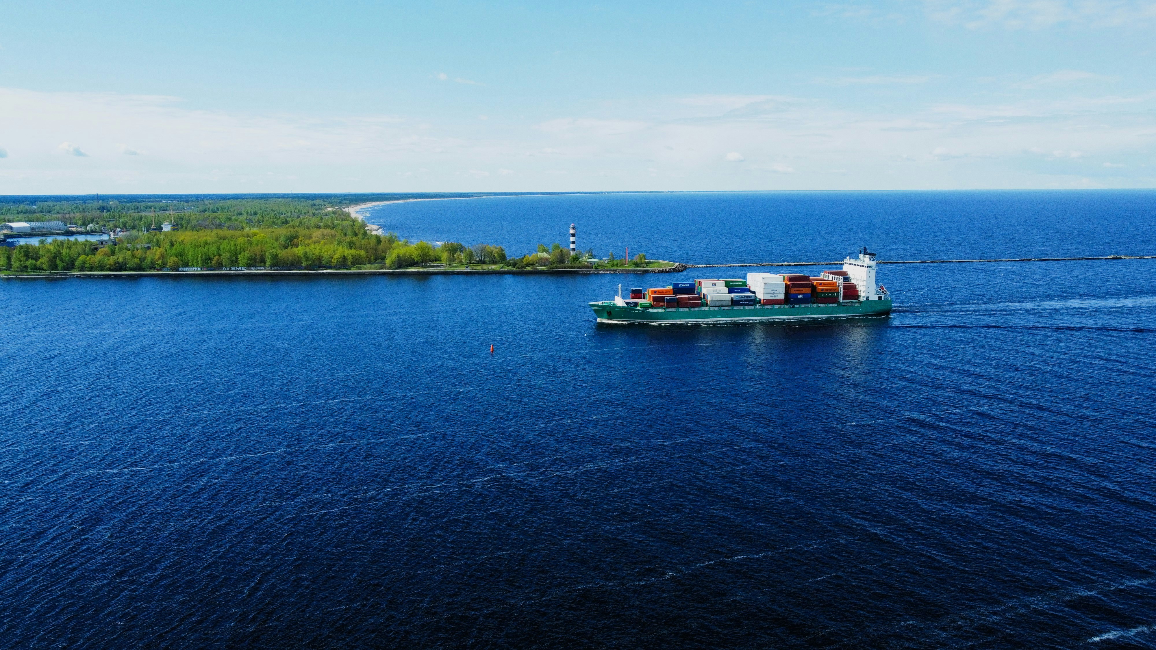 a large boat traveling across a large body of water (Photo by M V on Unsplash)