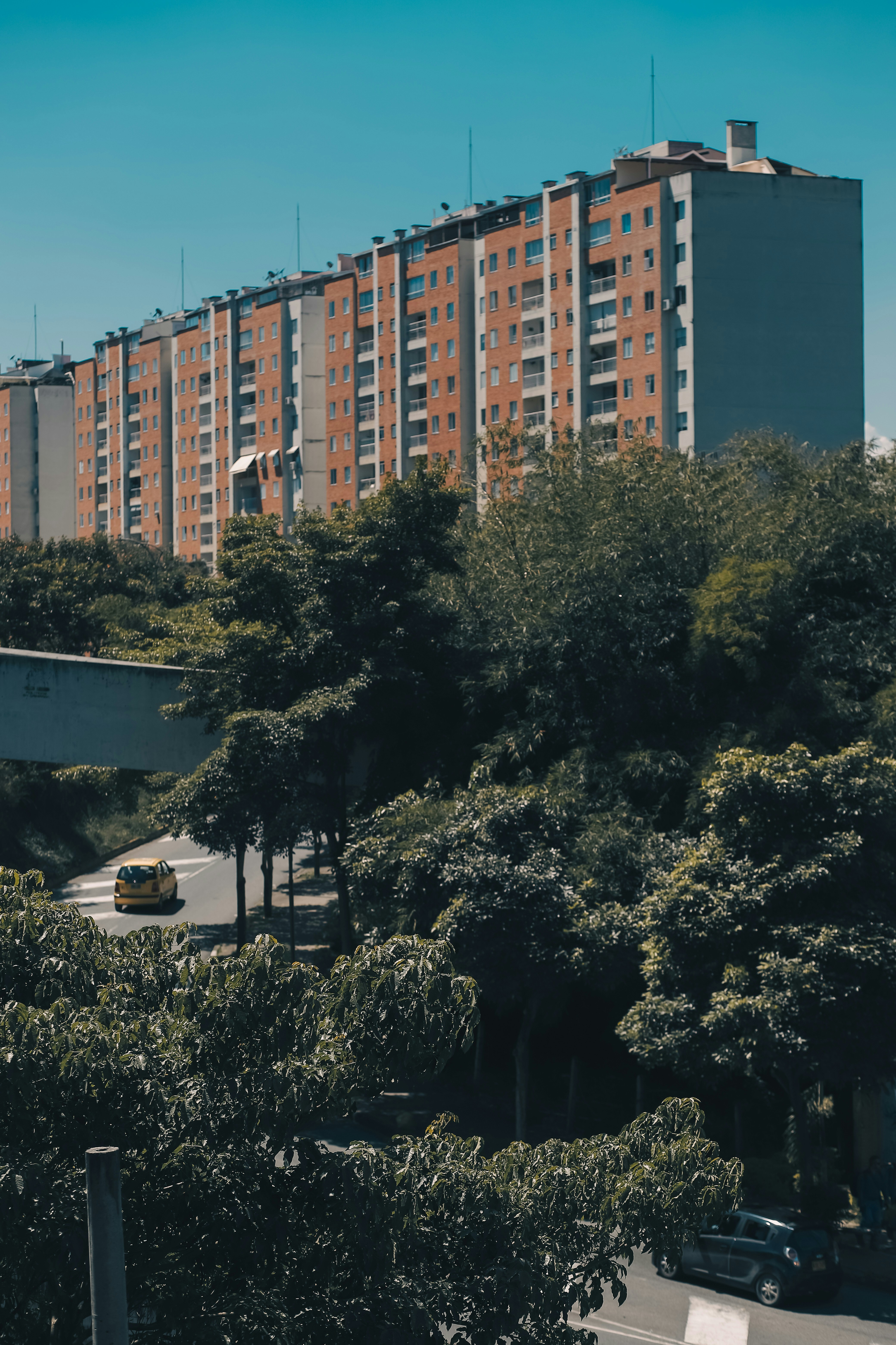 a view of a parking lot with a building in the background