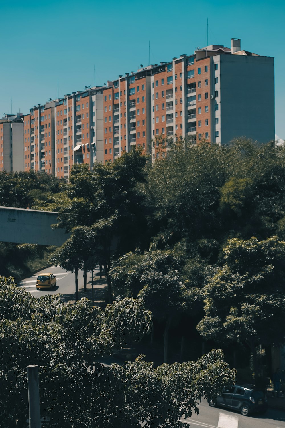 a view of a parking lot with a building in the background