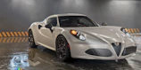 A high-performance car parked under metallic silver lighting, highlighting its curves.