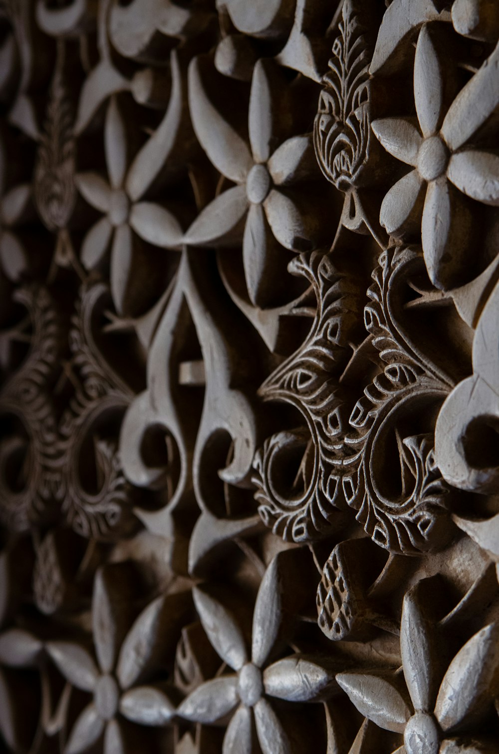 a close up of a decorative wall made of wood