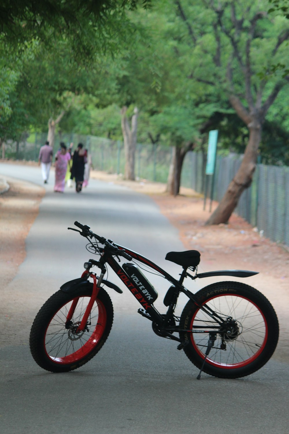 a bicycle parked on the side of a road