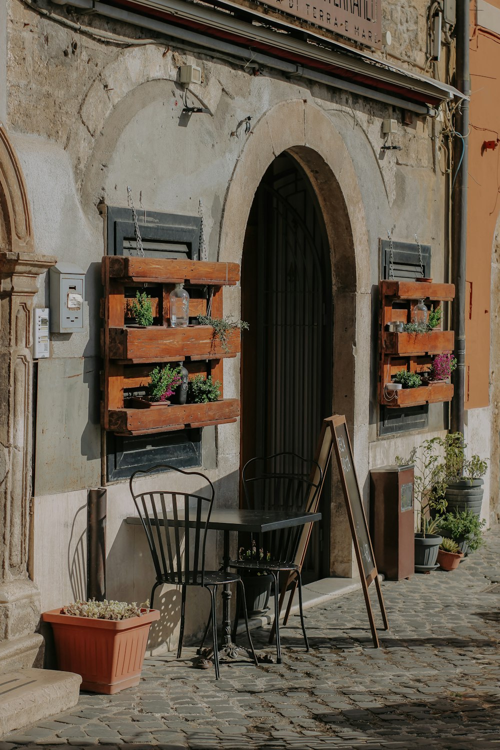 a table and chairs outside of a building