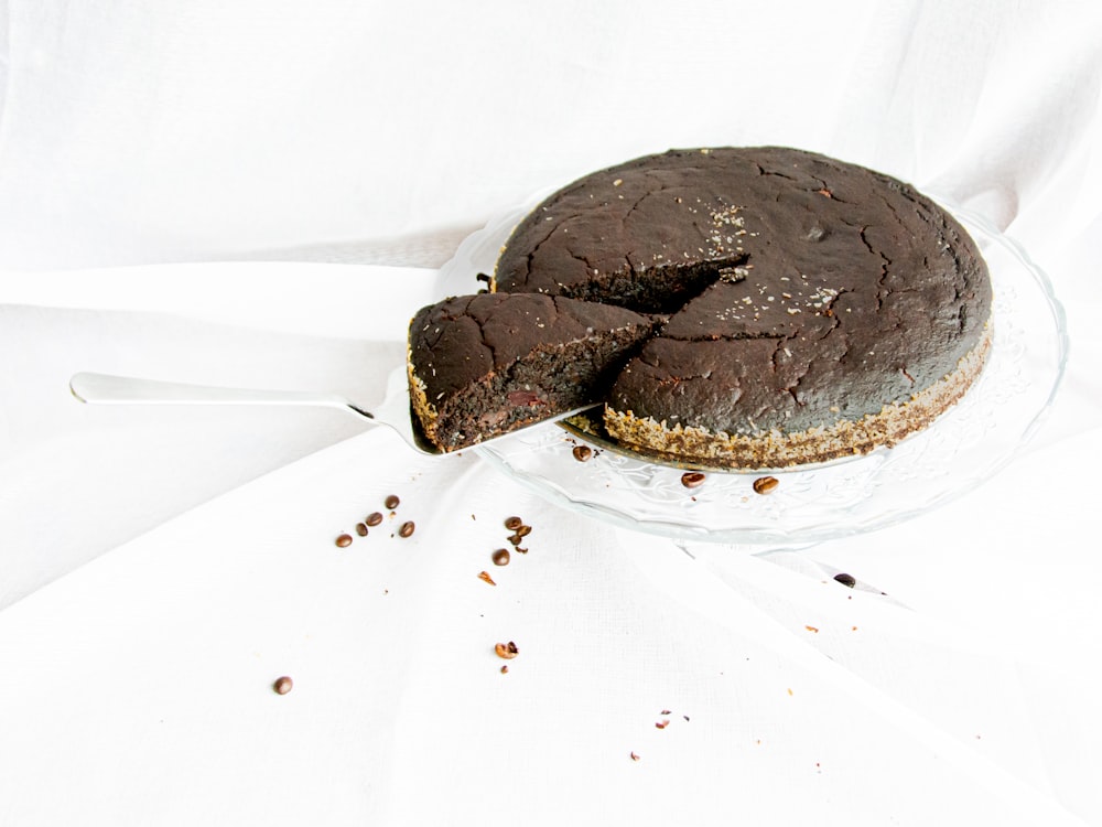 a chocolate cake with a slice cut out of it