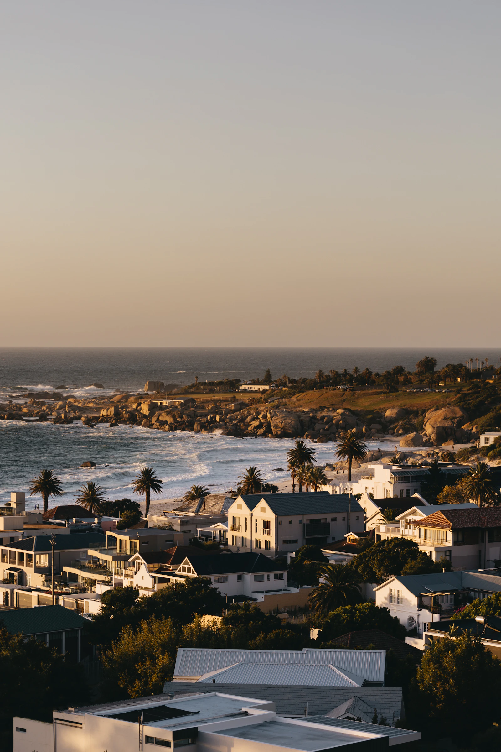 Camps Bay coastline with houses and ocean view — temporary placeholder, replace with own photography