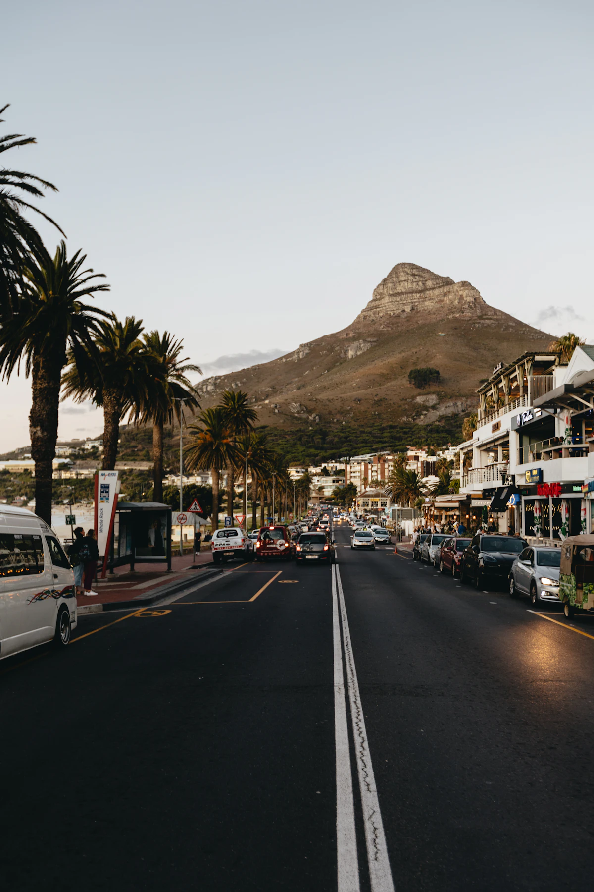 Victoria Road in Camps Bay with palms and Lion’s Head