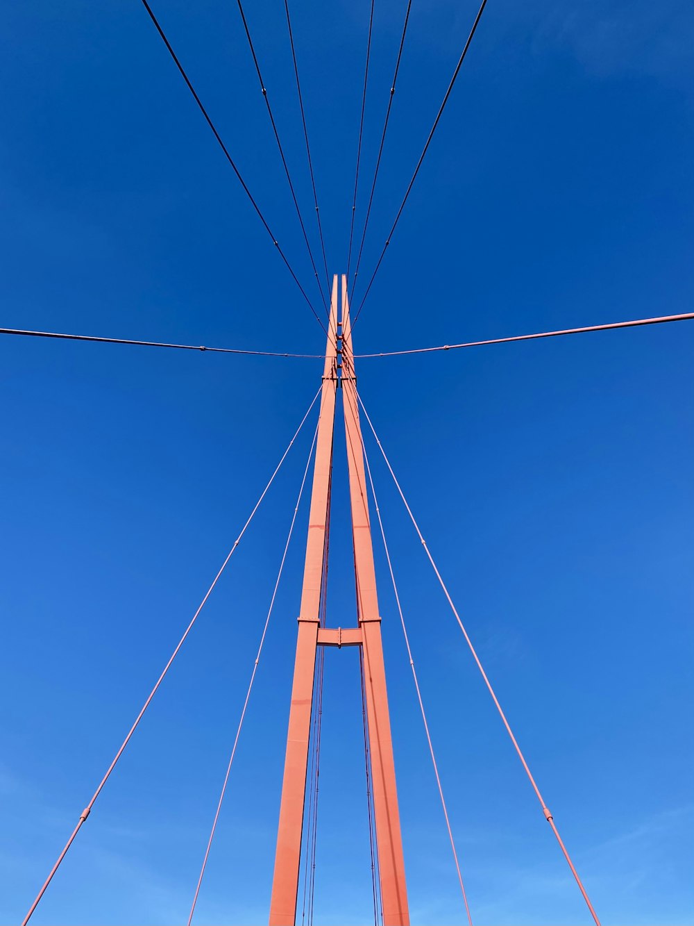 a view of the top of a bridge from below
