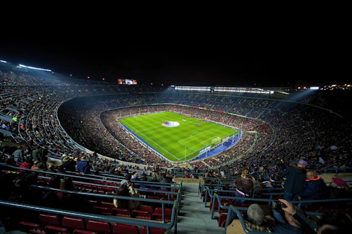 A dynamic live stream setup capturing a thrilling football match under stadium lights.