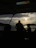 Sunset view from the boat with silhouettes of islands in the distance.