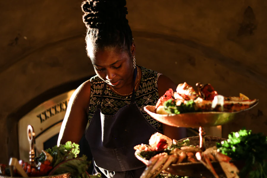 Food and beverage professional presenting plated dishes