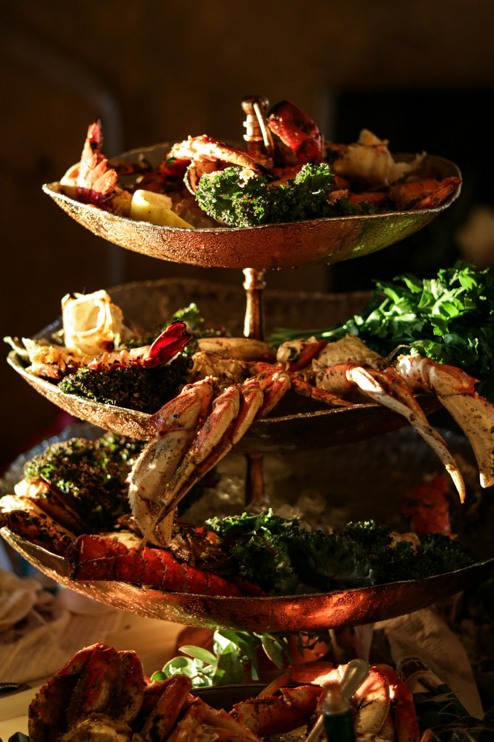 a three tiered tray of food on a table