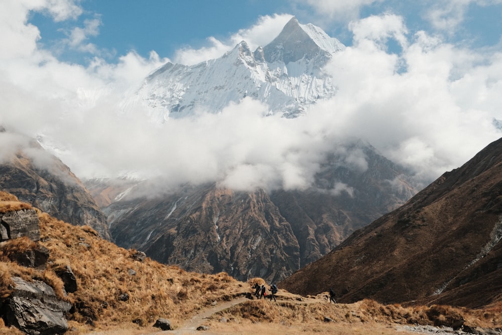 a group of people hiking up a mountain