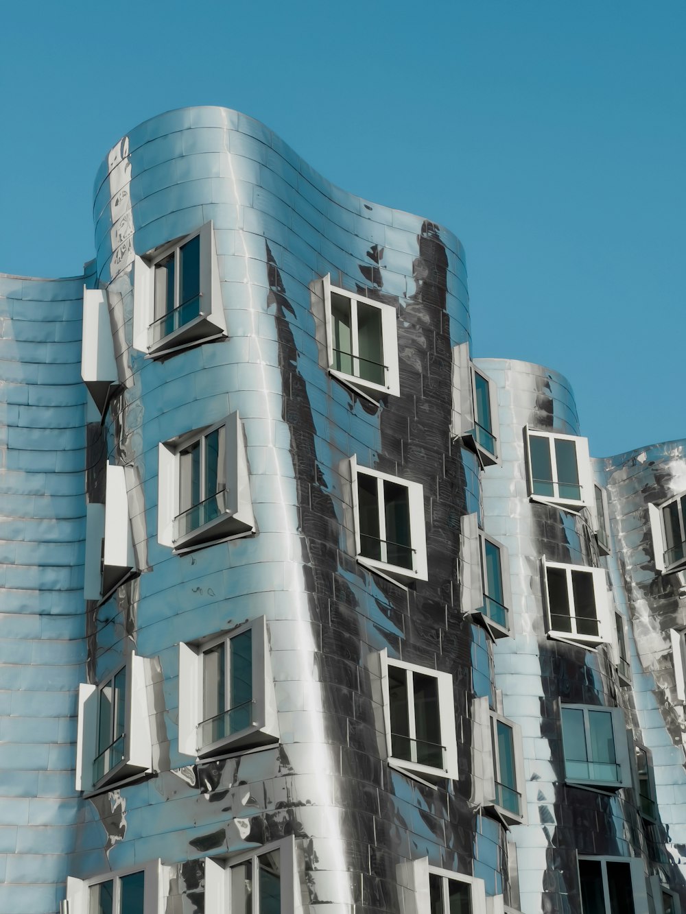 a tall building with many windows on the side of it