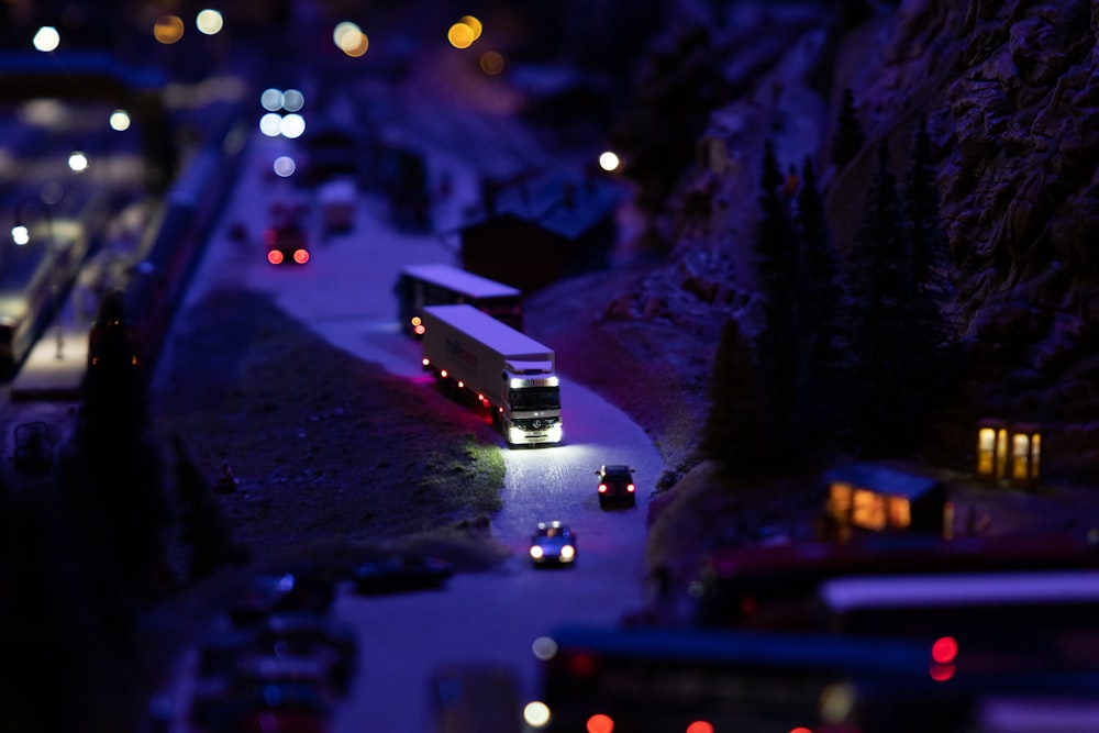 a toy model of a bus on a road at night