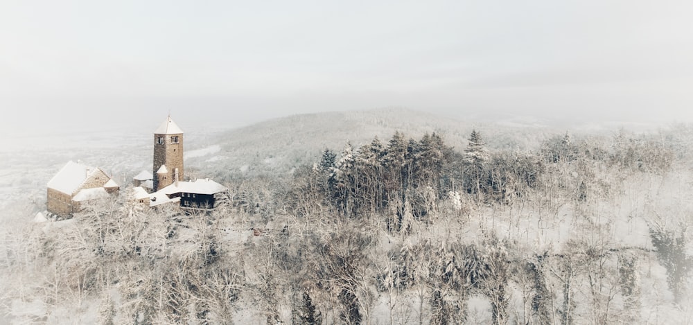 a snowy mountain with a church on top of it