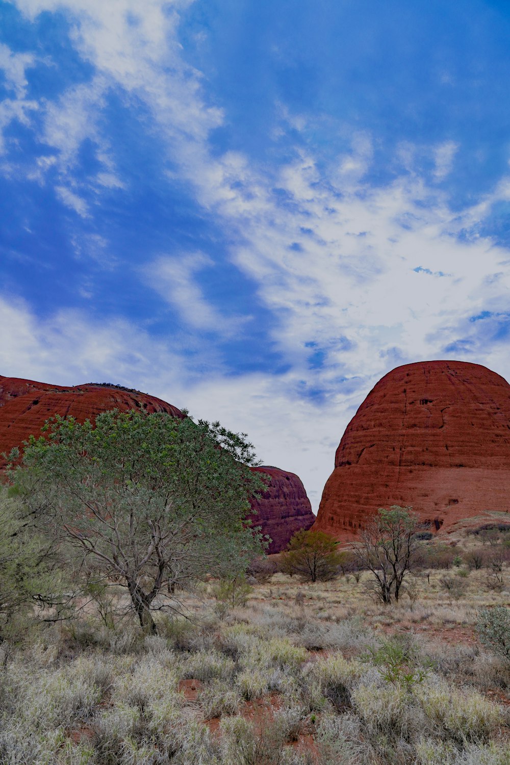 a large rock formation in the middle of a desert