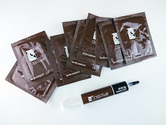 a group of chocolate bars sitting next to a tube of toothpaste