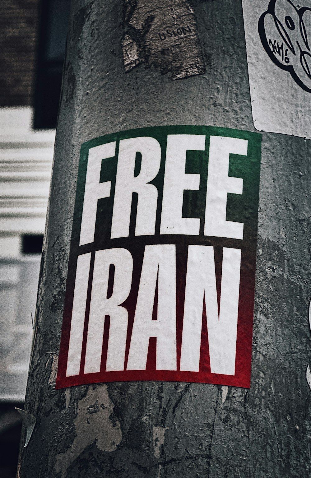 a free iran sticker on a tree