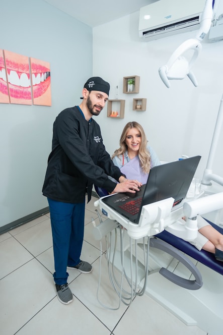 Friendly dentist welcoming a patient in a modern dental office.