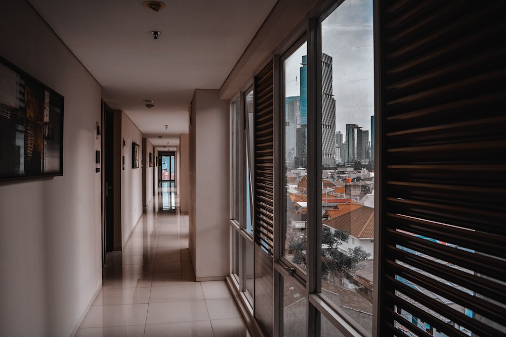 a long hallway with a view of a city