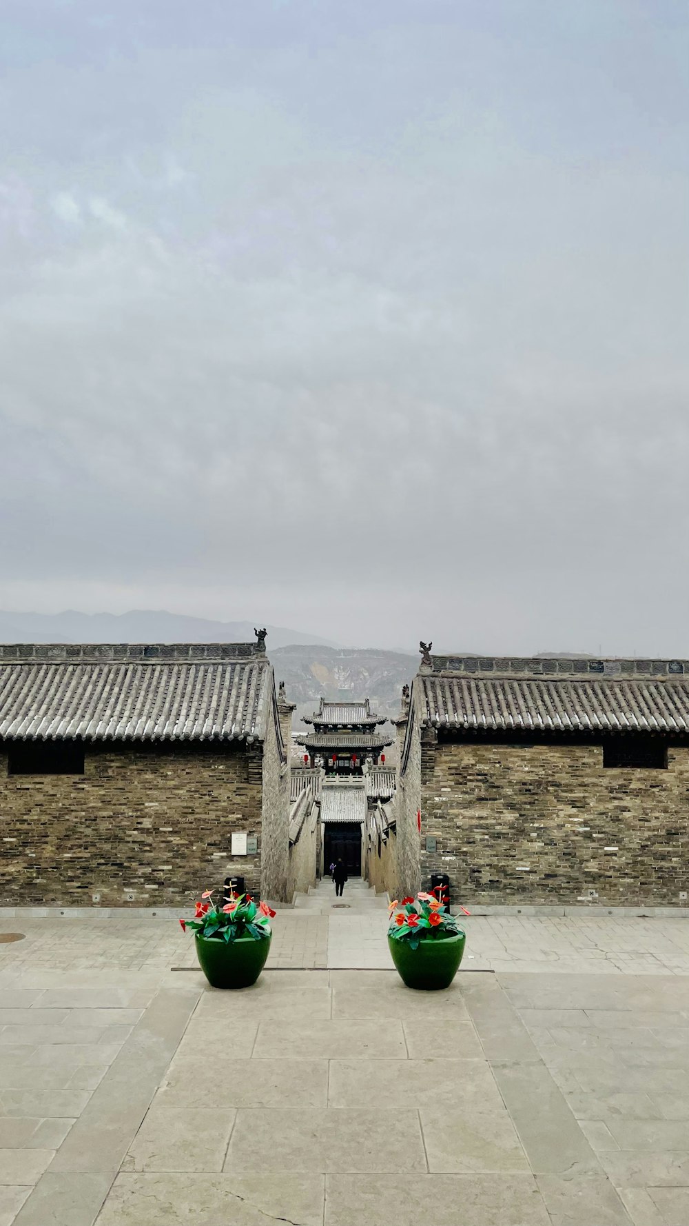 a couple of green boats sitting in front of a building