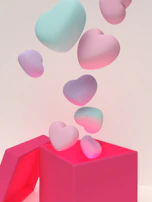 Pop-me surprise bobo balloon bursting open to reveal a delicate gift inside.