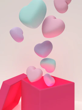 A transparent bobo balloon with a small gift box inside, surrounded by soft pastel decorations.