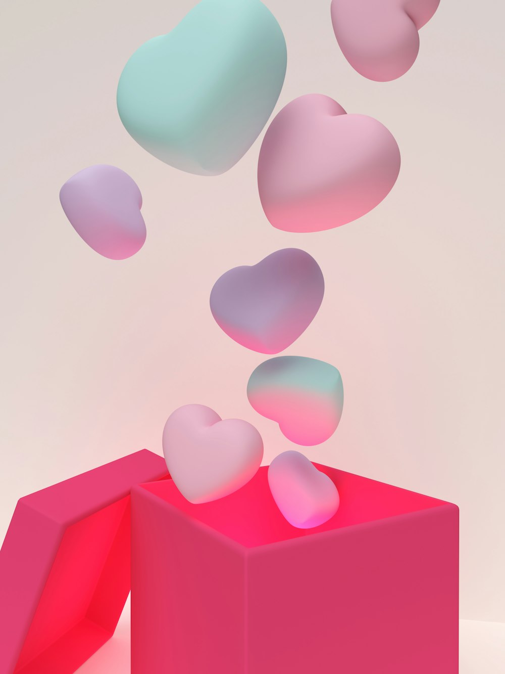 a pink box with hearts flying out of it